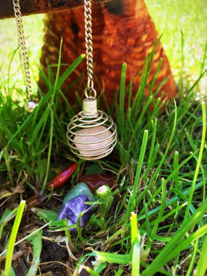 Cage with assorted crystals